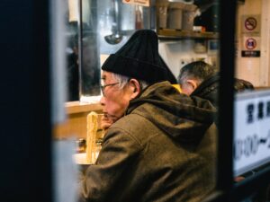 man eating noodles