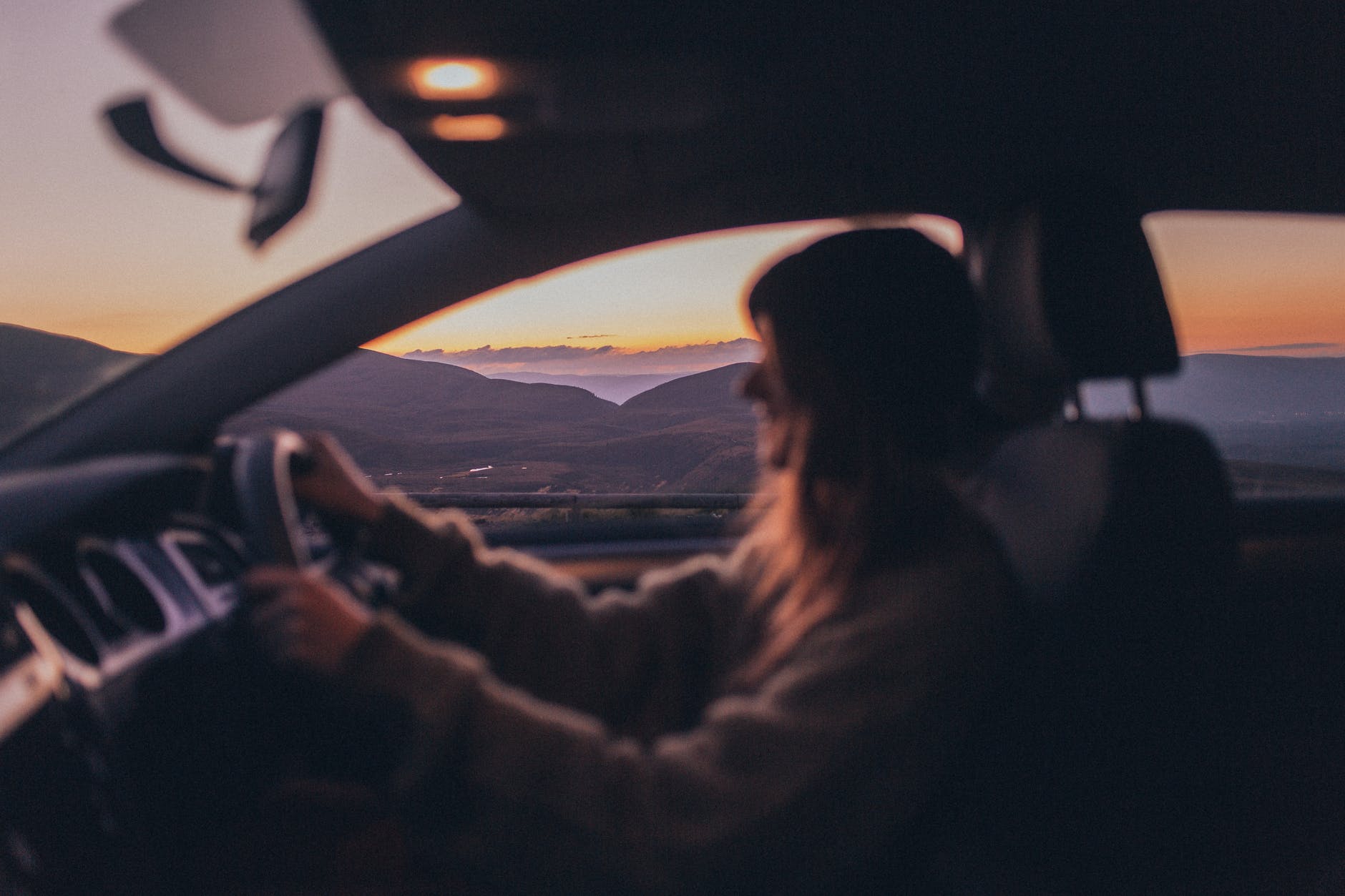 photo of person driving a vehicle