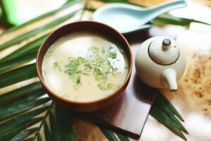 brown ceramic bowl with soup