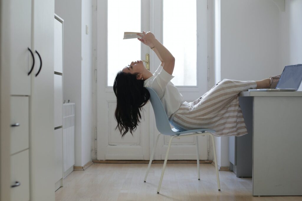 female asian student reading paper