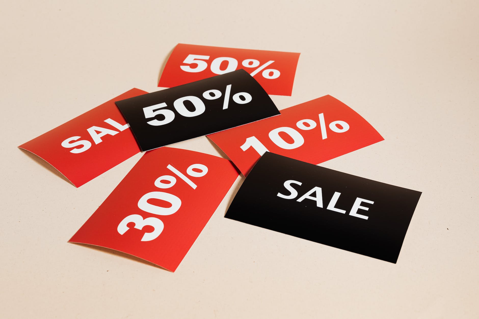 sale cards on beige background