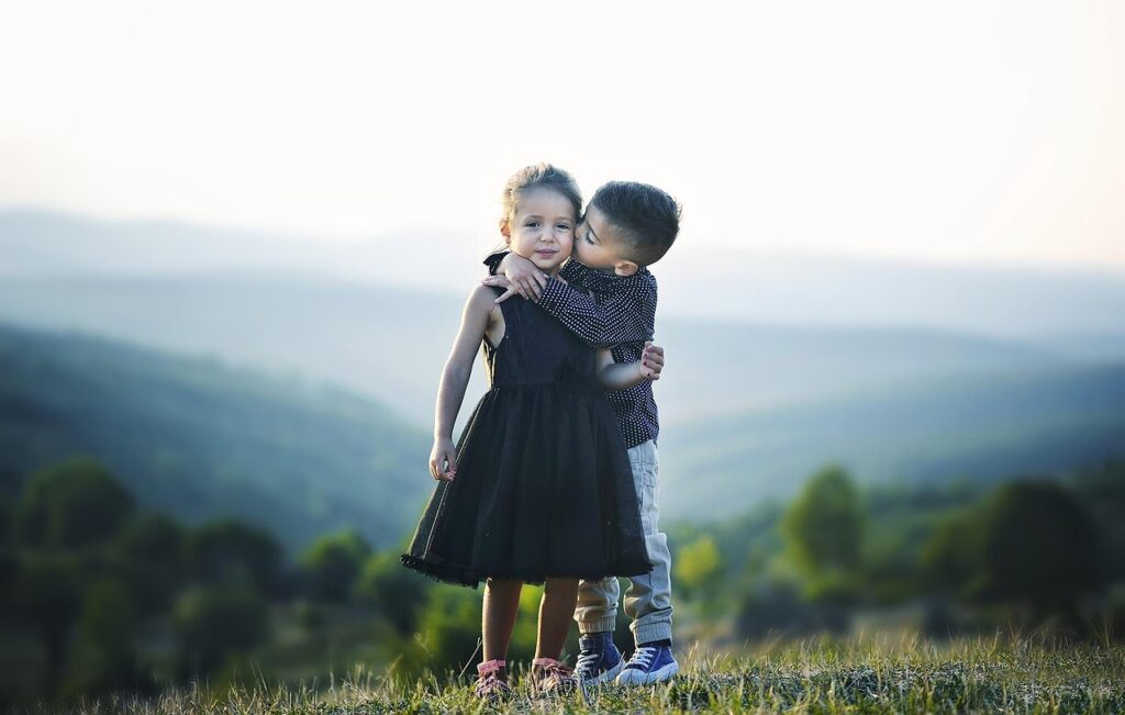 children hug siblings brother 920131